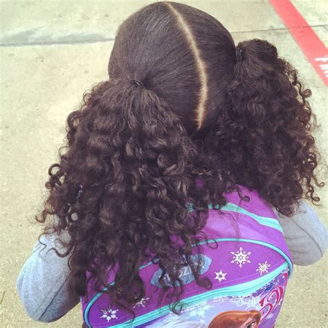 lower ponytail|2 low curly ponytails.